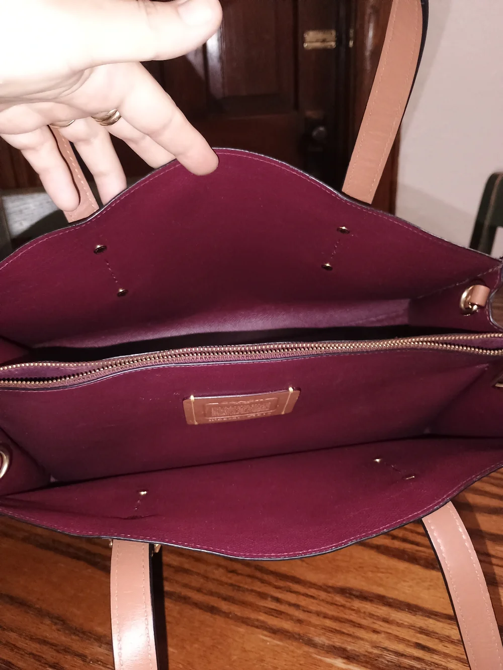 Coach Navy Signature Tote with A Wine Color Interior .